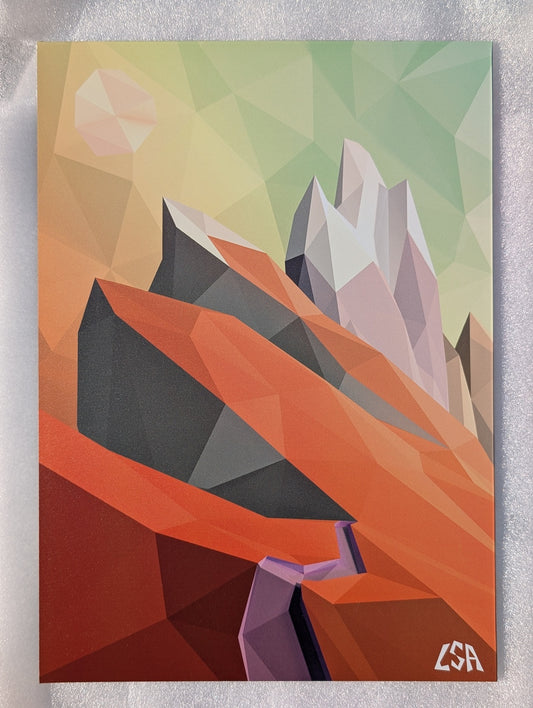 A low-poly geometric aluminium print featuring abstract mountains in orange, red, gray