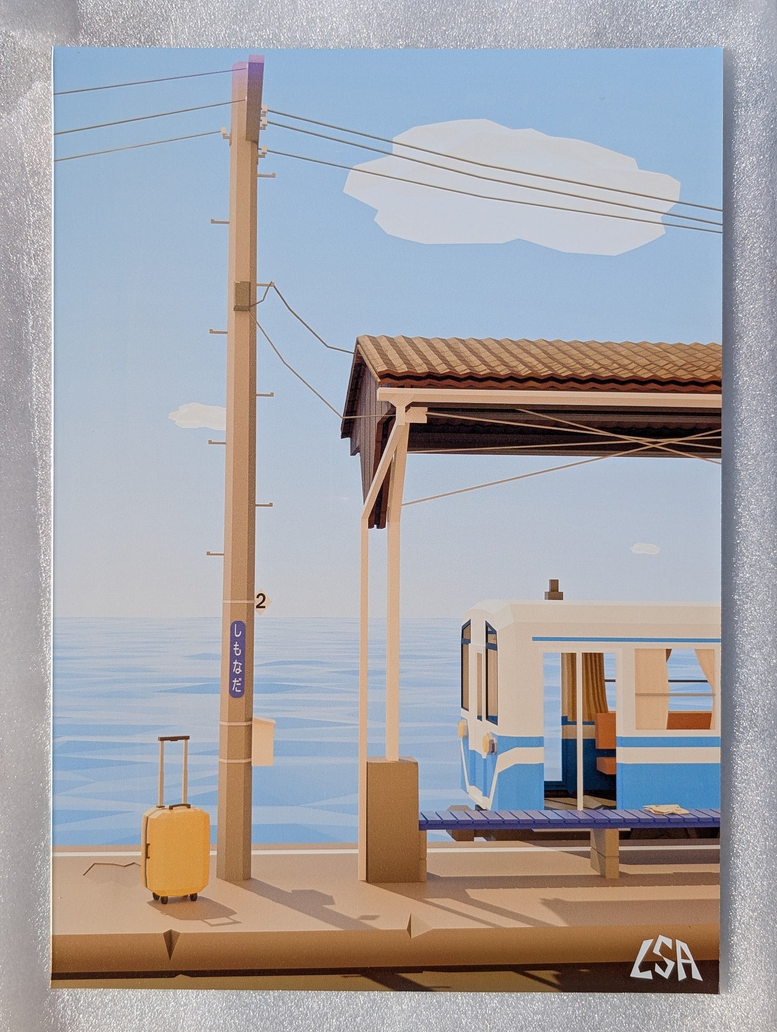 A low-poly stylized aluminium print featuring a train station platform with a blue ocean in the background, a train, a utility pole, a suitcase, and a small cloud in the sky