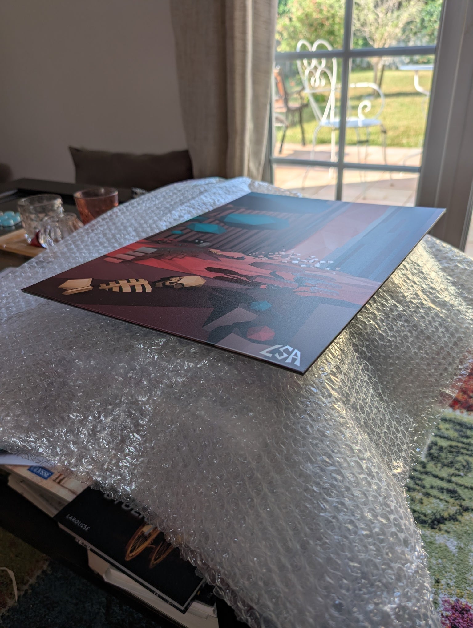 light reflecting on aluminium print to show the glossy finish