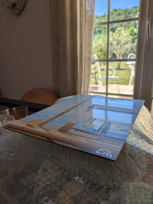 light reflecting on metal poster to show the glossy finish